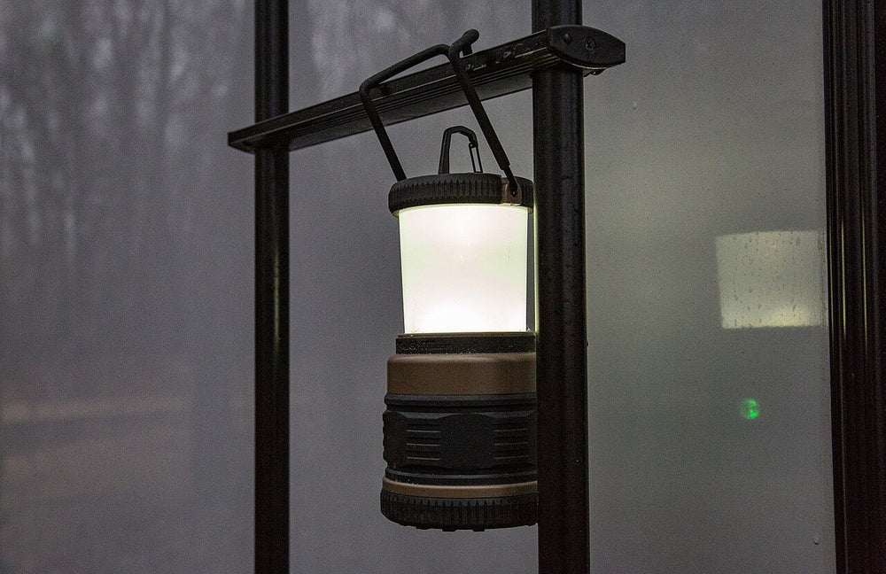 LED camping lantern hanging inside a tent