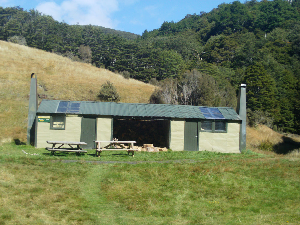 Flora Hut beside the bush in Kahurangi National Park.