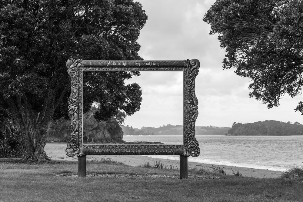 The harbour view through a wooden frame at Mahurangi Regional Park.
