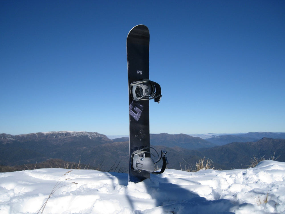 A snowboard standing in the snow at Mount Buller.
