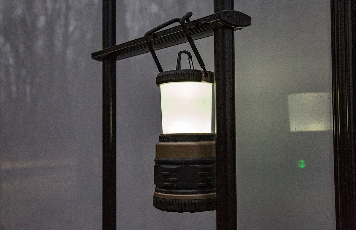 LED camping lantern hanging inside a tent
