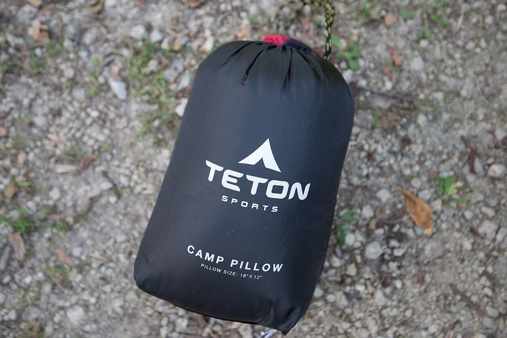 Packed camping pillow in its carry bag