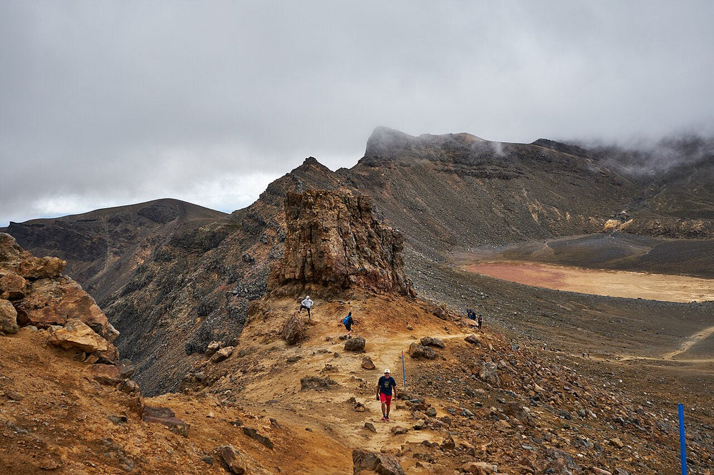 Walkers among volcanic ridges on the Tongariro Alpine Crossing in 2019.