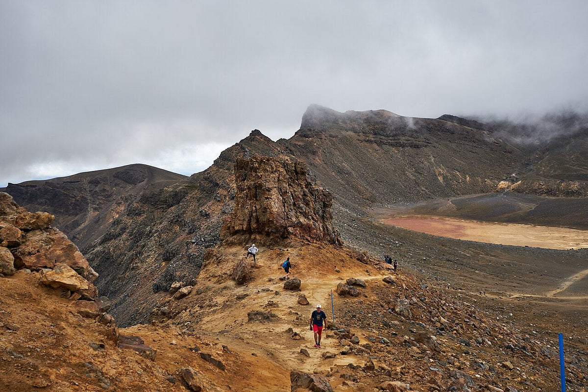 Walkers among volcanic ridges on the Tongariro Alpine Crossing in 2019.