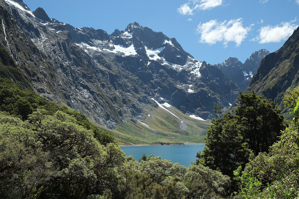 Lake Marian beneath steep mountains in Fiordland.