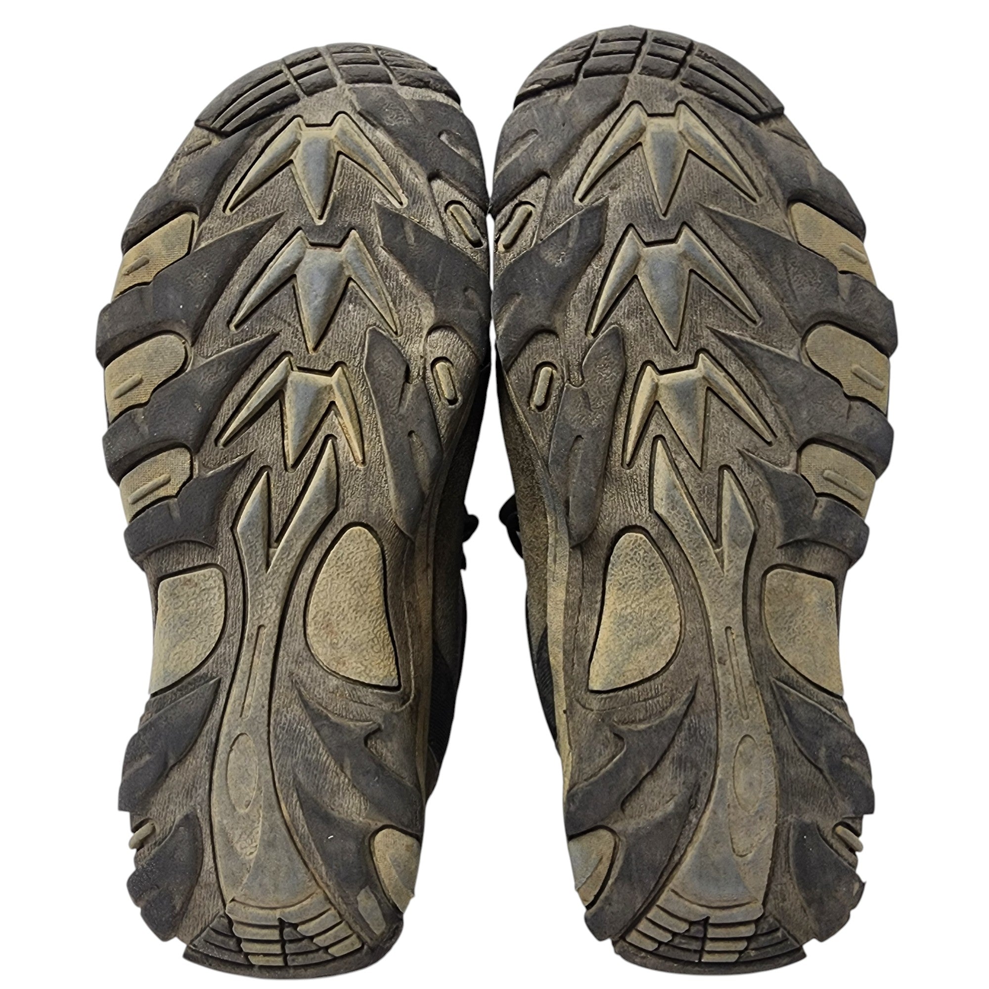 Close-up of a pair of brown hiking boots with tread pattern on a white background