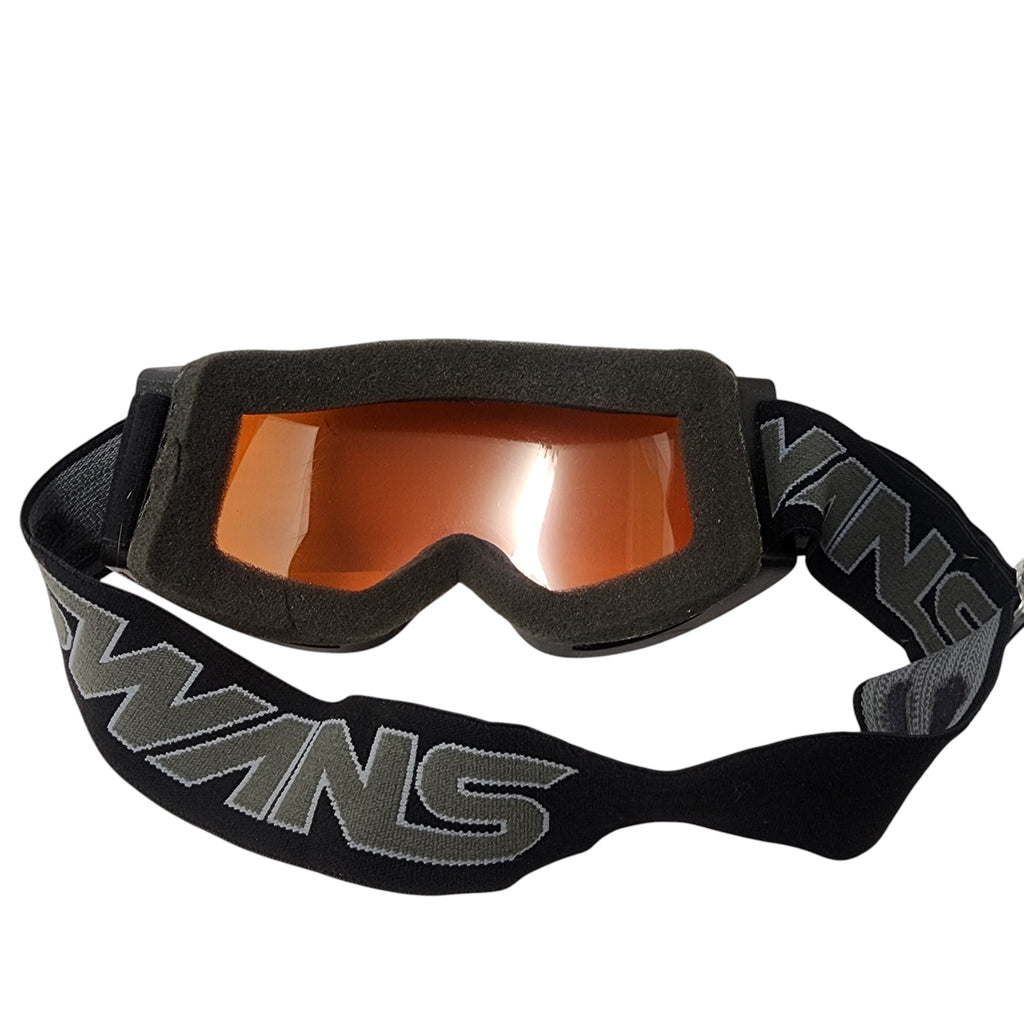 Black goggles with orange lenses and 'SUN' branding on a white background