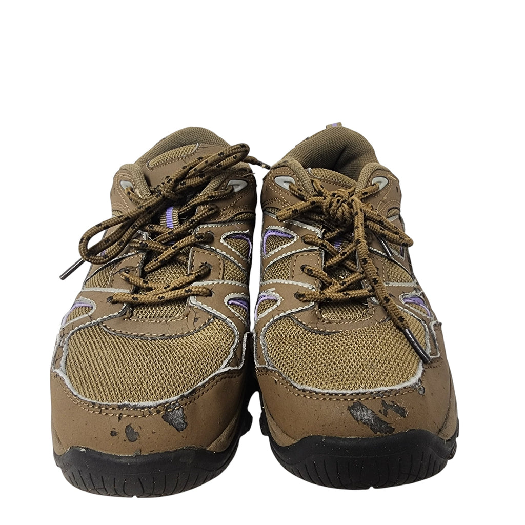 Pair of brown hiking shoes with black soles on a white background