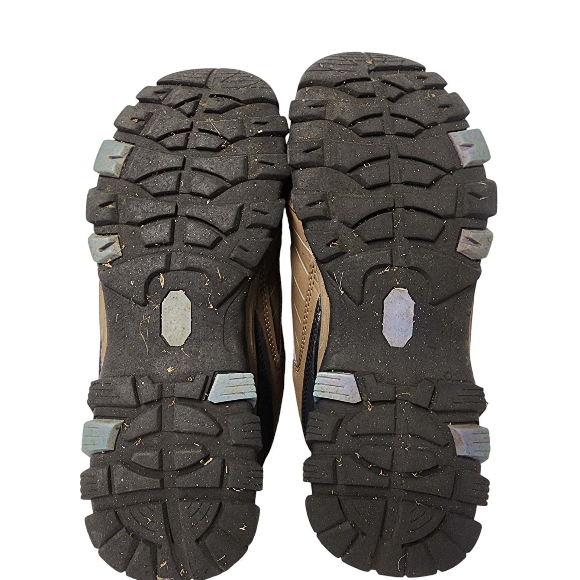 Close-up of the sole of a hiking shoe with tread pattern on a white background