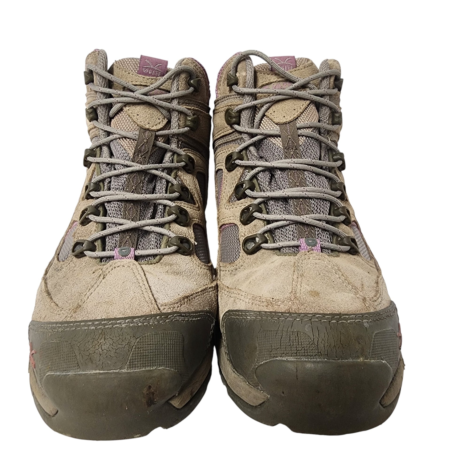 Pair of worn hiking boots on a white background