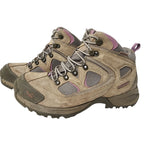 Pair of hiking boots with a beige and brown color scheme on a white background
