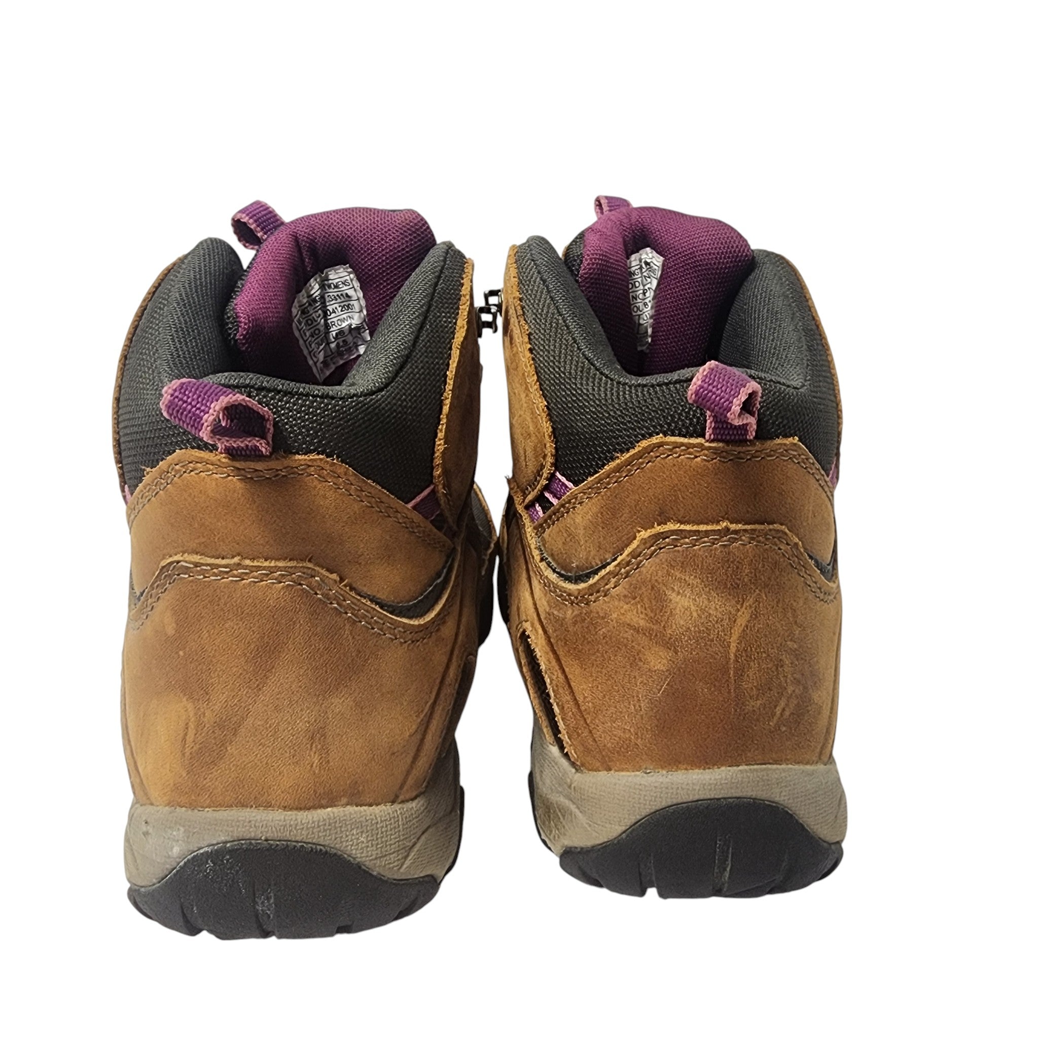 Pair of brown hiking boots with purple accents on a white background