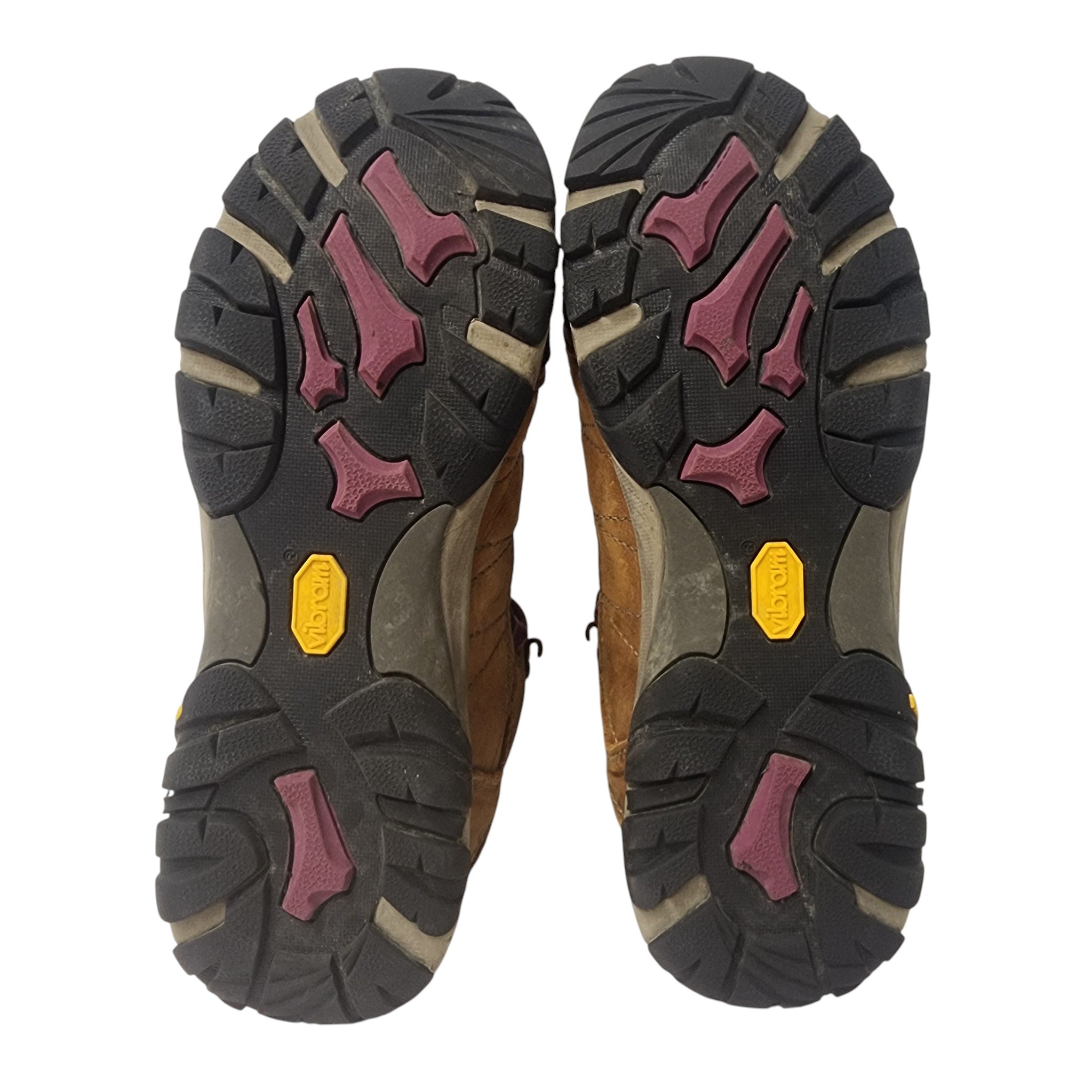 Close-up of a pair of hiking boots with focus on the sole design.