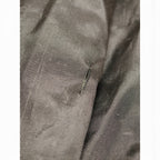 Tear in long black ski bag