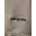 Embroidery close-up Patagonia logo on Patagonia Capilene top
