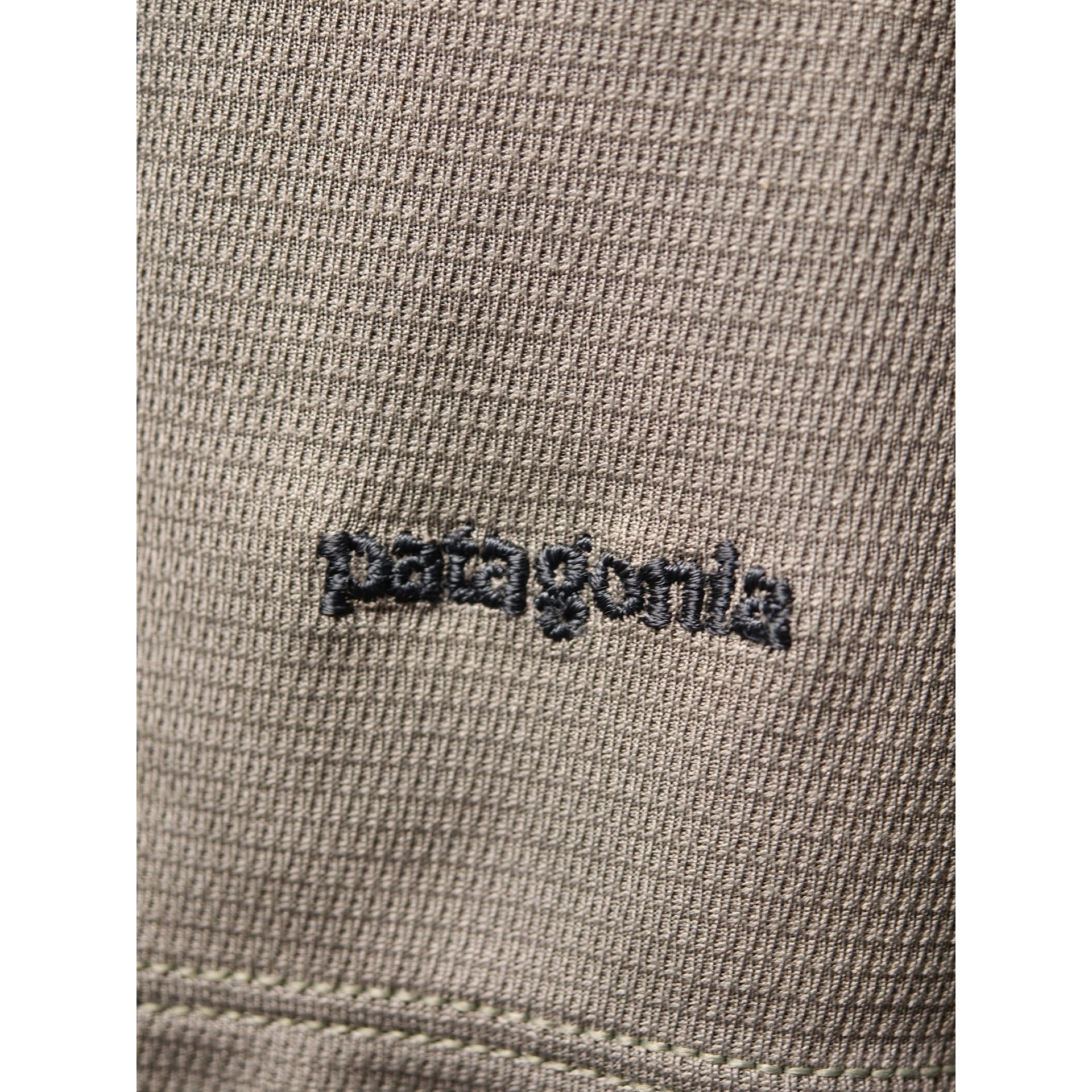 Embroidery close-up Patagonia logo on Patagonia Capilene top