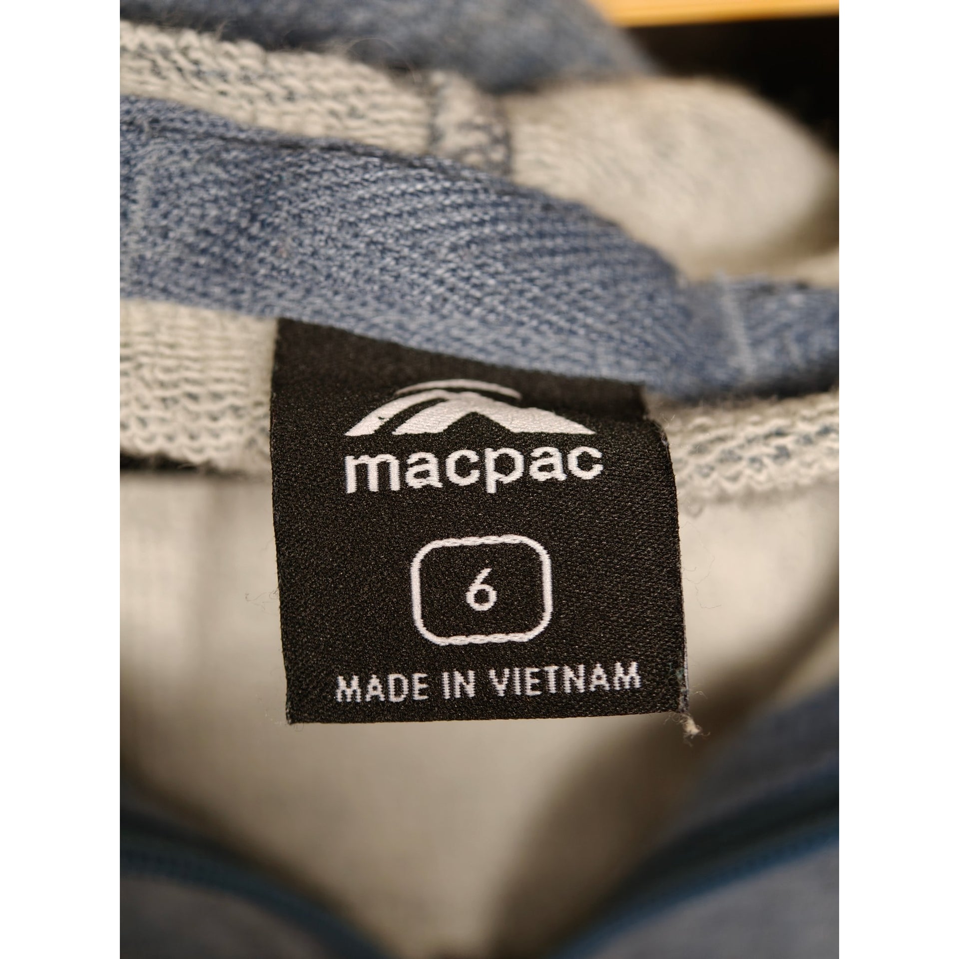 Macpac size 6 label inside grey hoodie