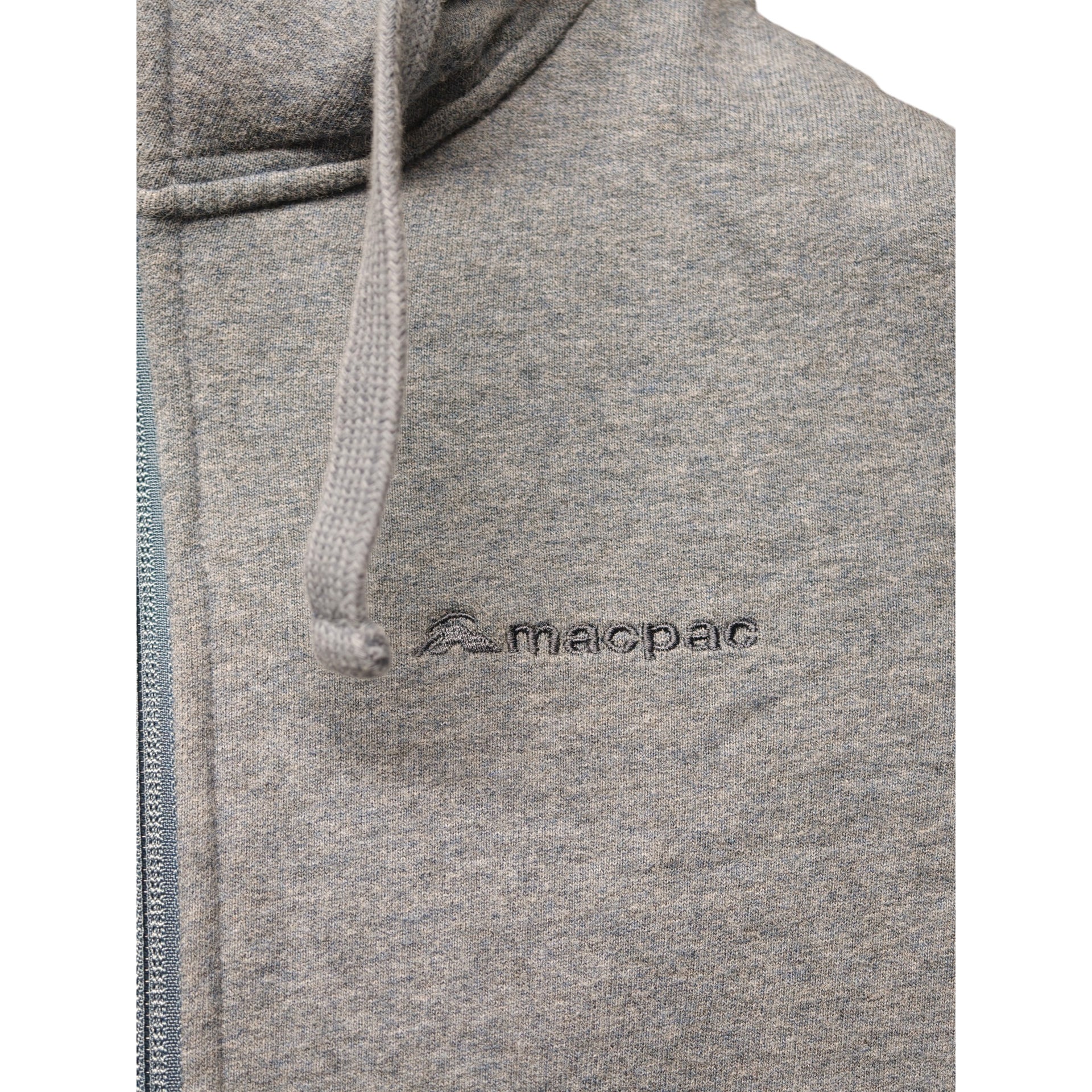 Close-up of Macpac logo embroidered on chest of hoodie