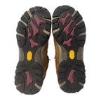 Close-up of a pair of hiking boots with focus on the sole design.