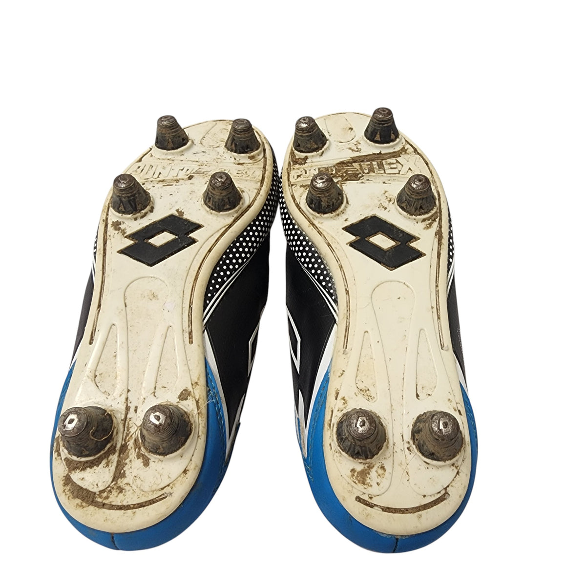 Pair of worn cleats with visible wear and tear on a white background