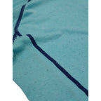 Close-up detail of Macpac aqua and navy long-sleeve base layer