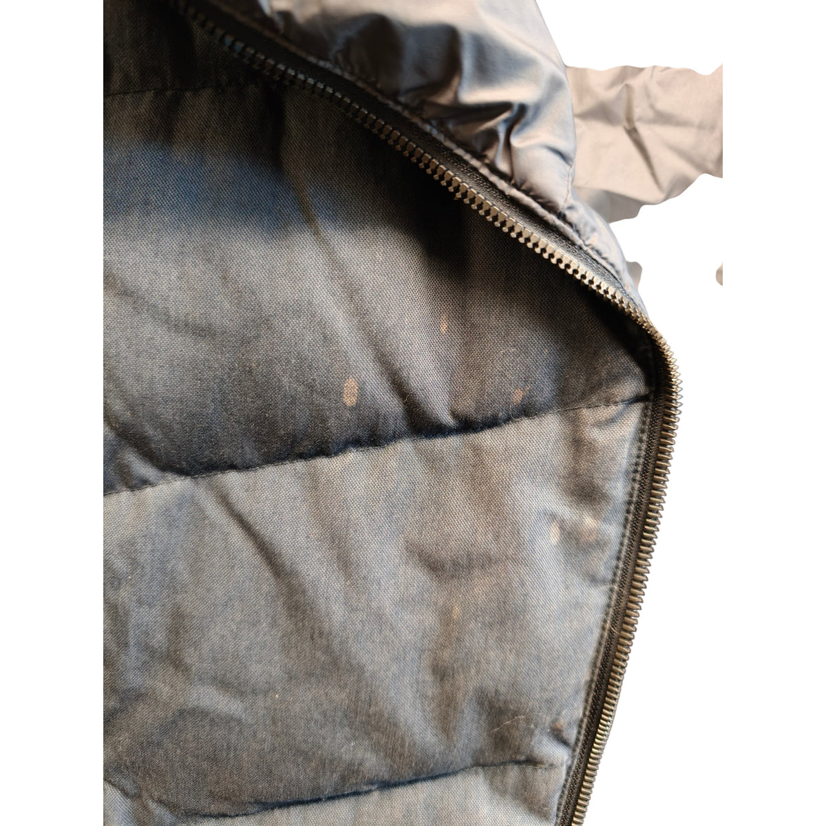 Zip and outer fabric close-up on the Macpac women's long insulated vest