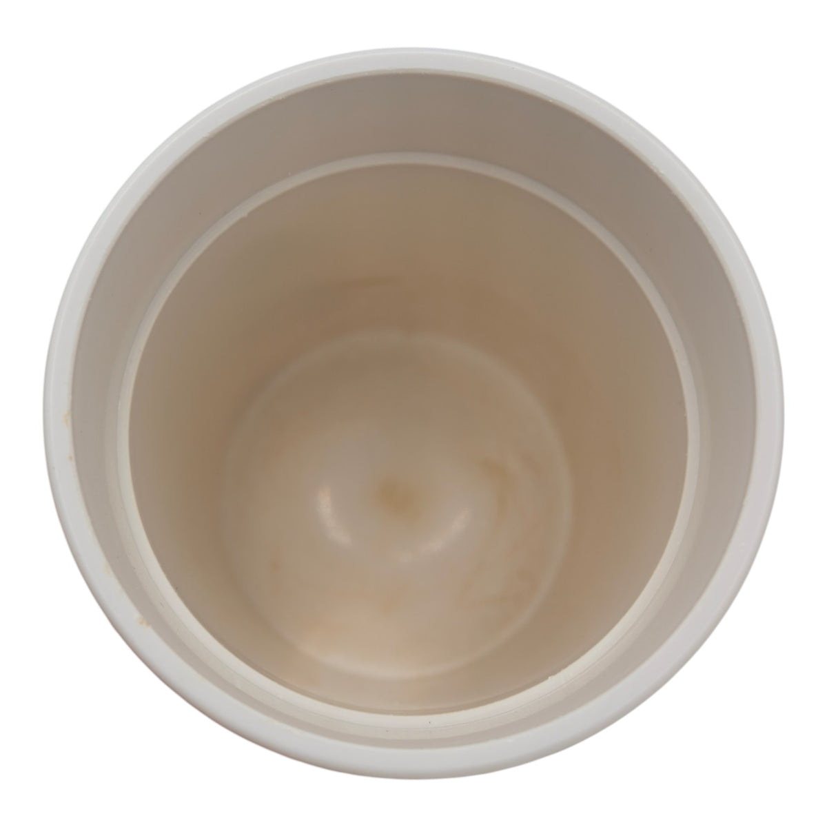 Inside of the reusable travel cup with yellow lid