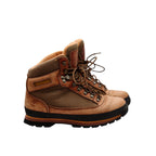 Timberland Gore-Tex hiking boots in tan leather and brown canvas with a durable sole. Features ankle support and waterproof lining.
