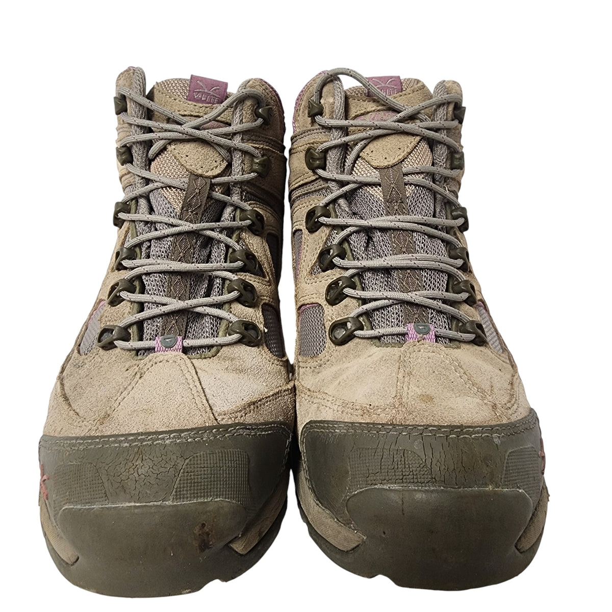 Pair of worn hiking boots on a white background